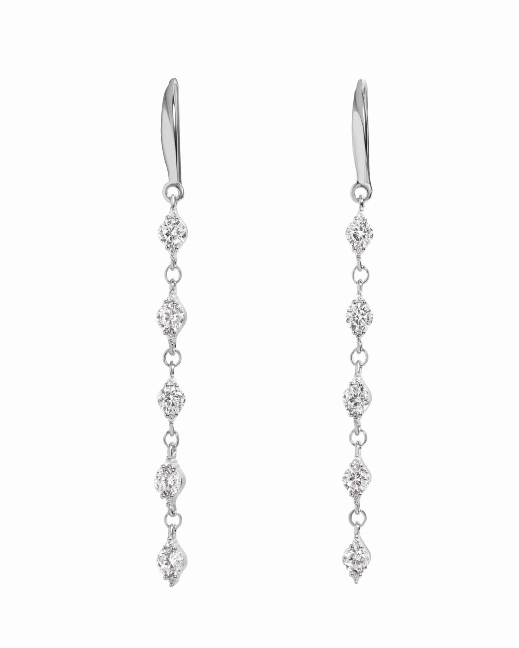 silver dangle earrings with cubic zirconia stones