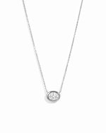 Silver east-west oval CZ bezel pendant necklace on a white background.