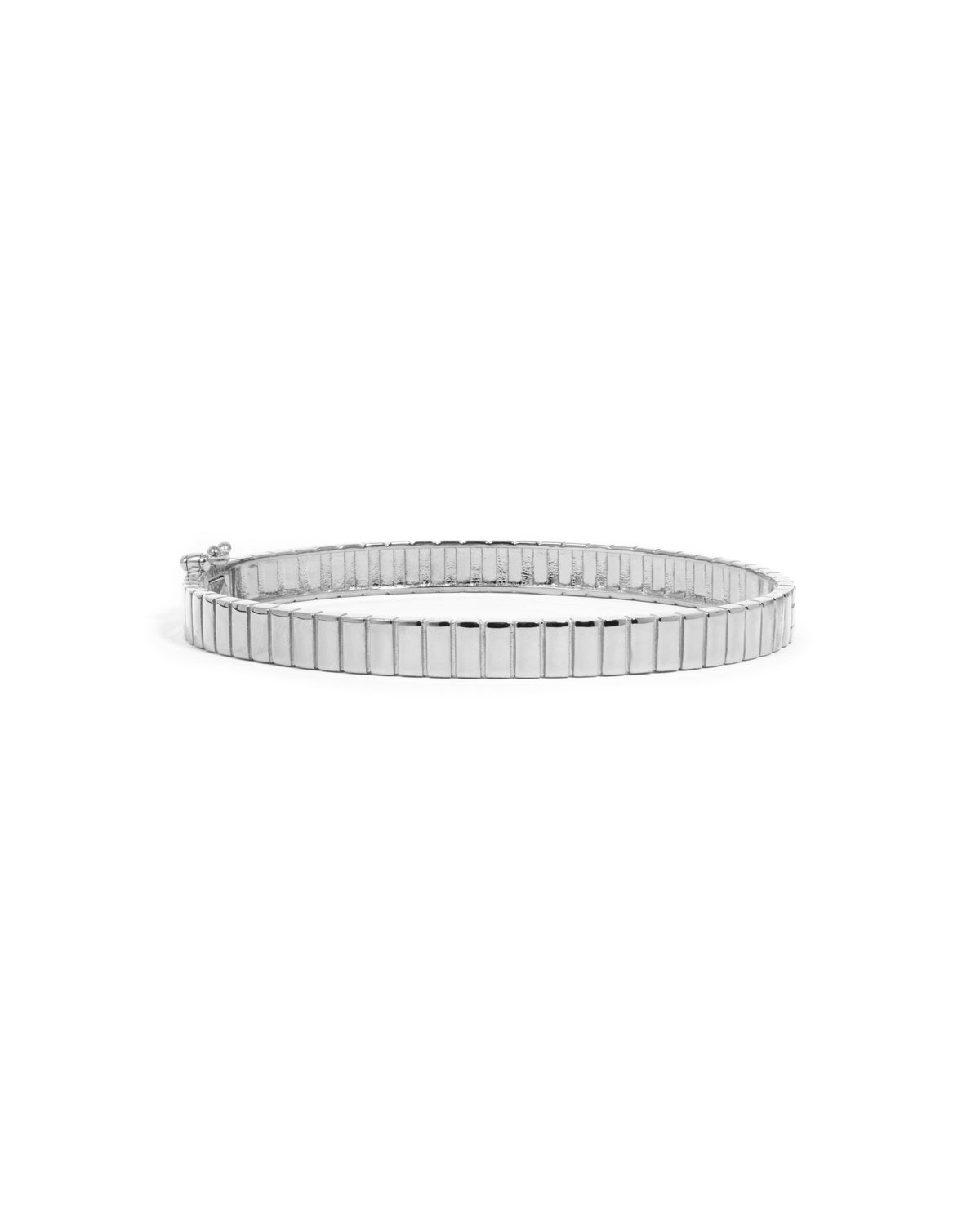 Silver fluted bangle bracelet on a white background.