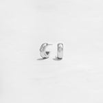 Closeup of simple silver small hoop earrings