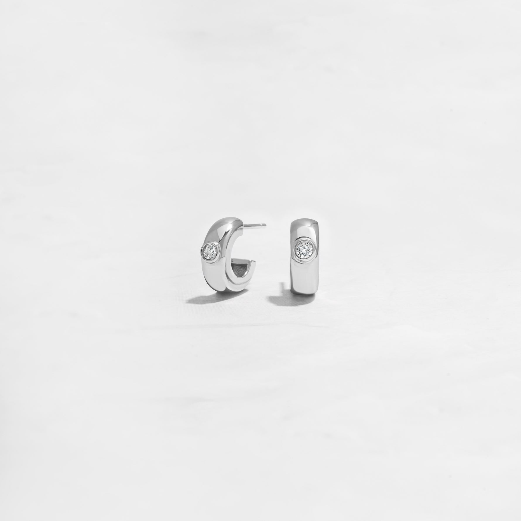 Closeup of simple silver small hoop earrings