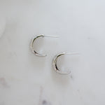 sterling silver hoop earrings with a celestial design