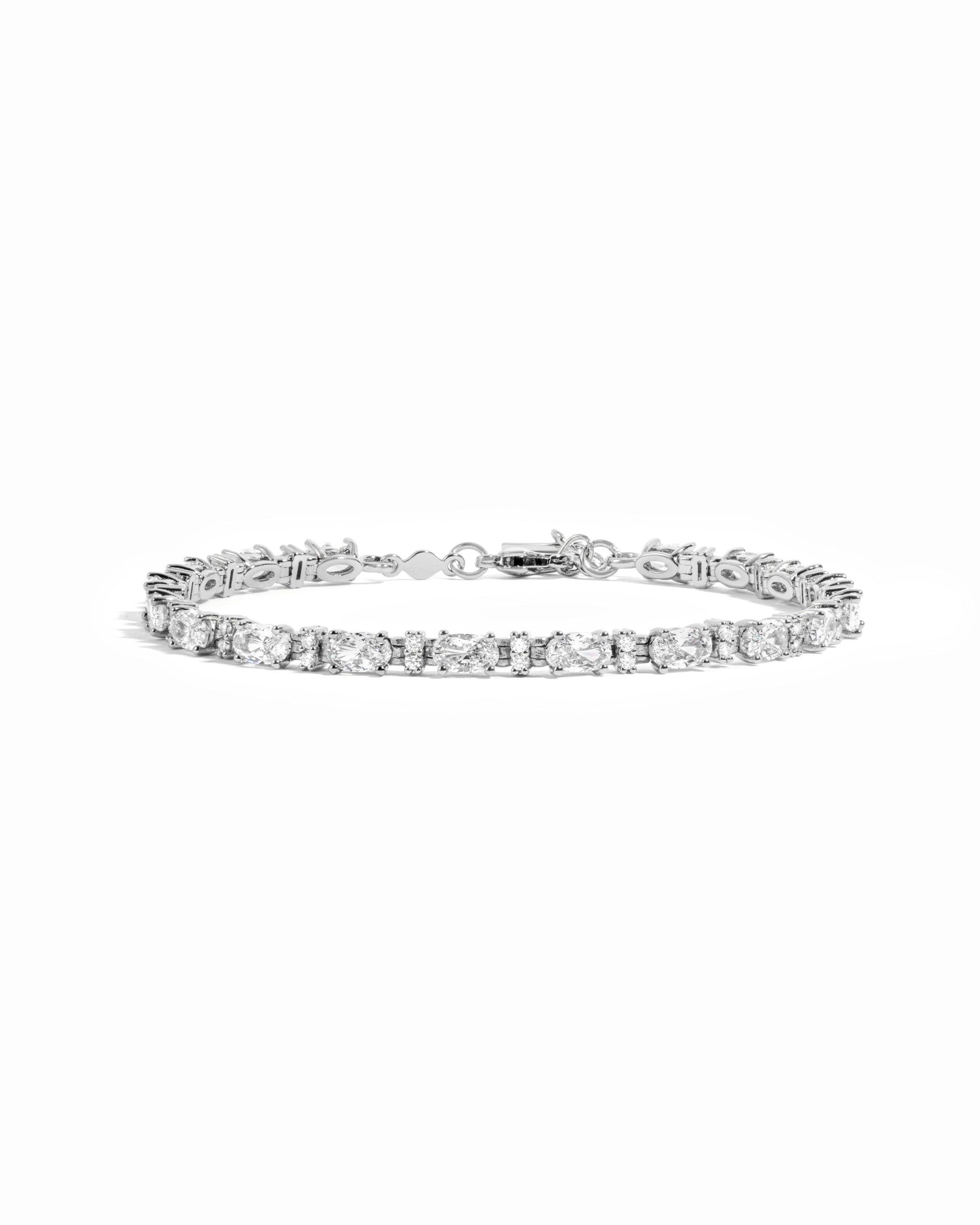 A silver white cubic zirconia tennis bracelet with alternating oval and round stones. 