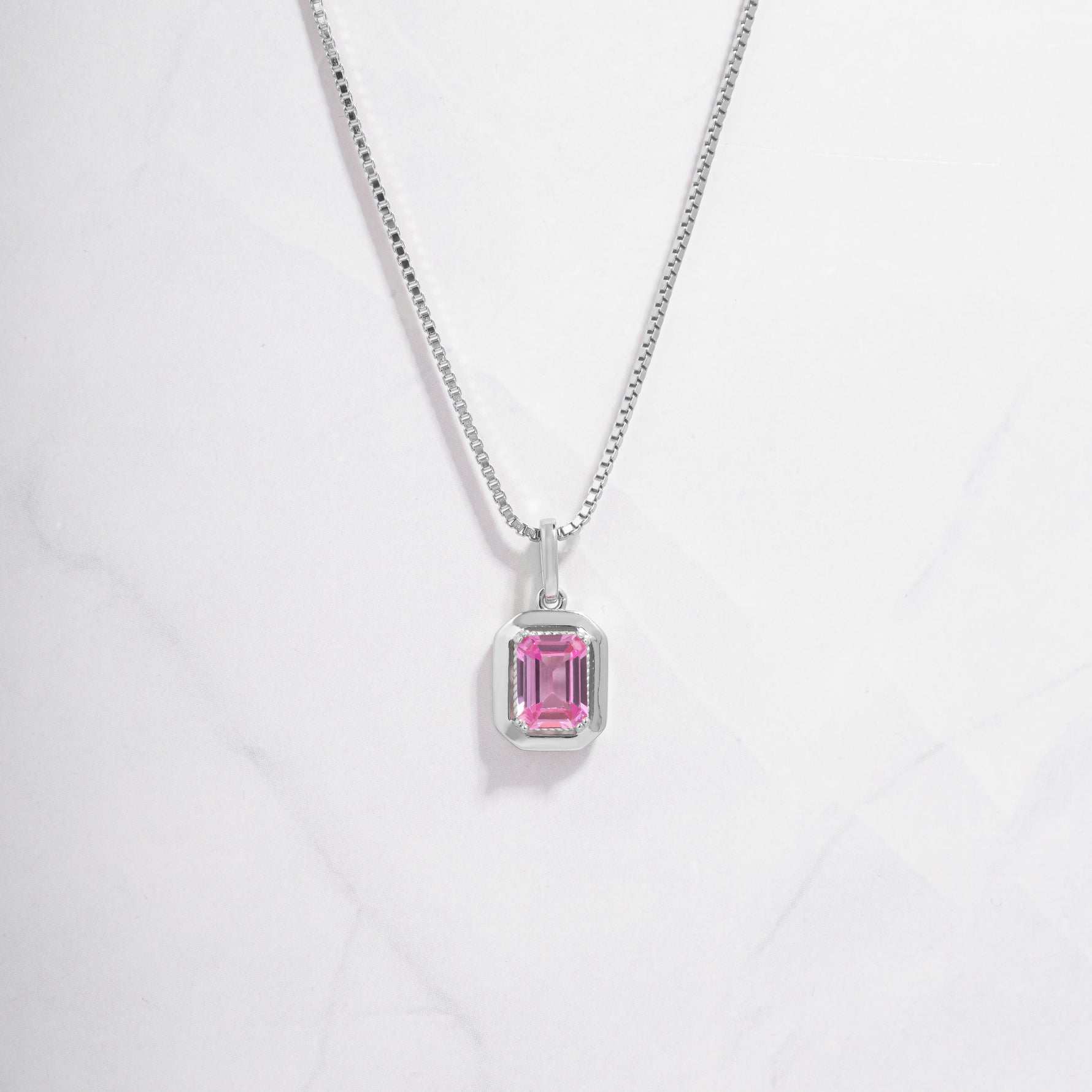 silver pendant necklace on box chain