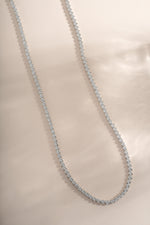 Silver round bezel tennis necklace by Sami Jewels, featuring a sleek, polished design with a smooth, round pendant.