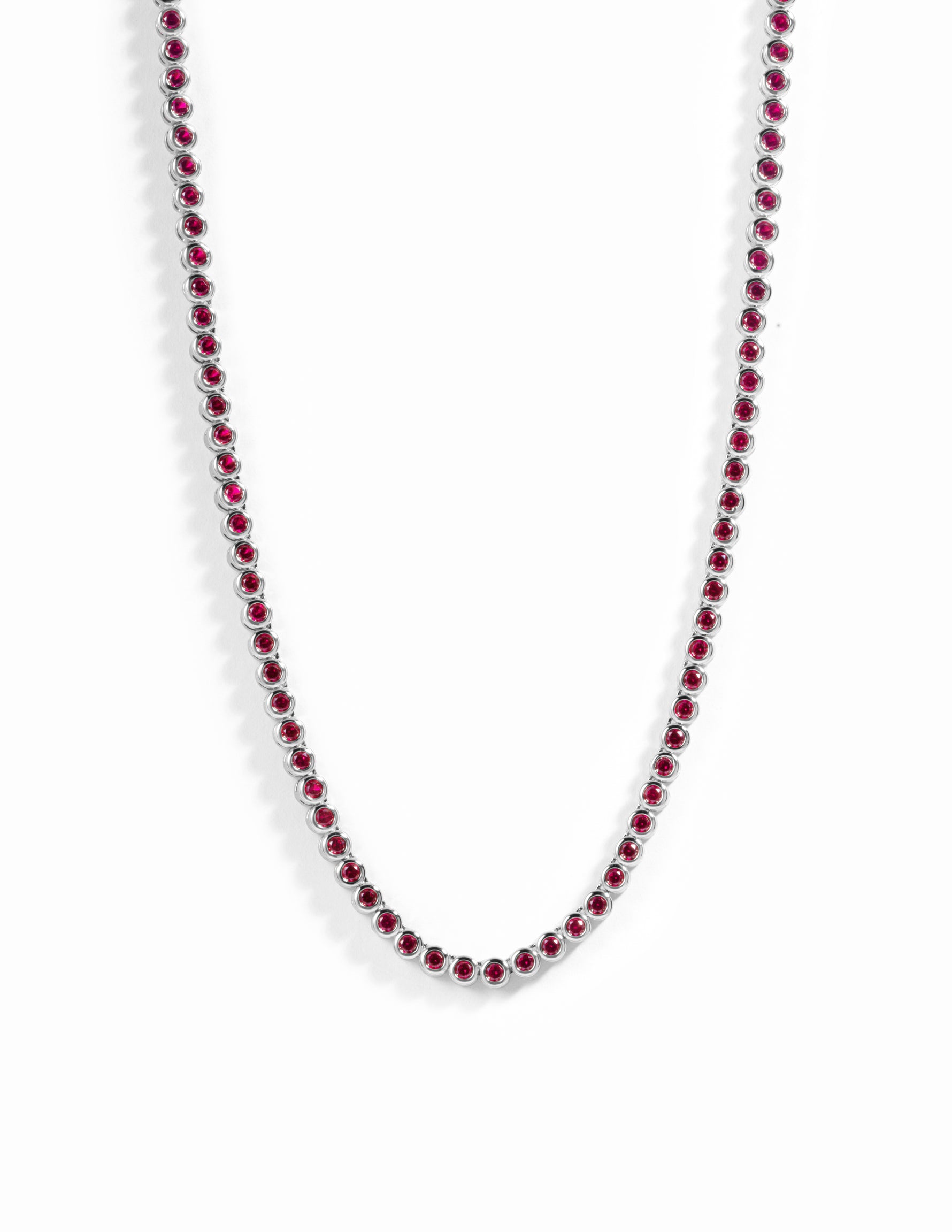 Silver Ruby Bezel Tennis Necklace by Sami Jewels featuring a row of sparkling rubies set in a sleek silver chain.