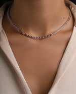 Silver Ruby Bezel Tennis Necklace by Sami Jewels worn on a model, showcasing a elegant gemstone choker style.