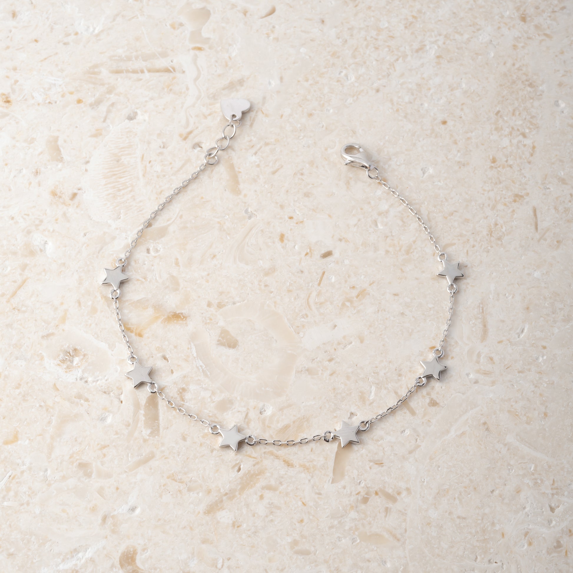 silver minimalist bracelet with star charms