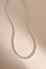 Silver Square Tennis Necklace by Sami Jewels featuring CZ stones and rhodium plating, showcasing a sleek, modern jewelry design.