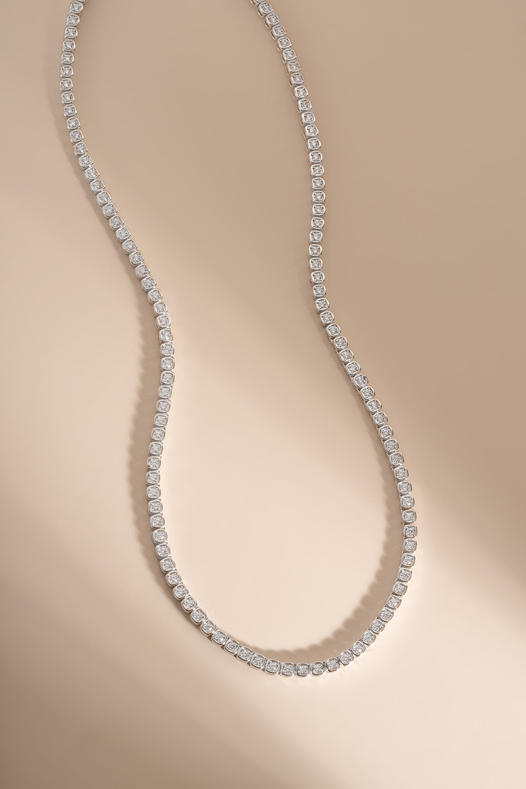 Silver Square Tennis Necklace by Sami Jewels featuring CZ stones and rhodium plating, showcasing a sleek, modern jewelry design.