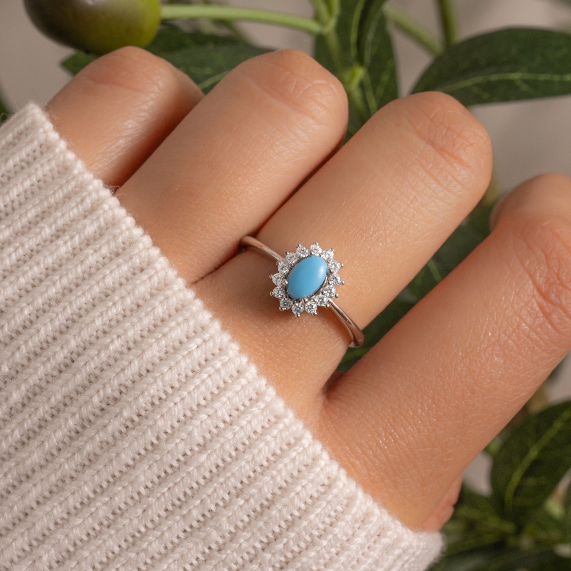 model wearing minimalist turquoise ring with halo