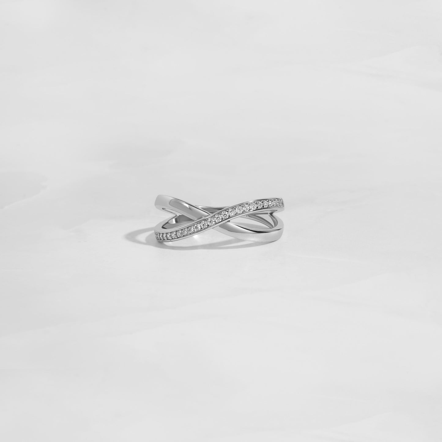 Close-up of a silver cross ring