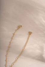 Gold beaded necklace from Sami Jewels featuring a lobster clasp closure and simple, elegant design.