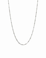 Sterling silver beaded necklace from Sami Jewels, featuring a simple design with small white beads against a white background.