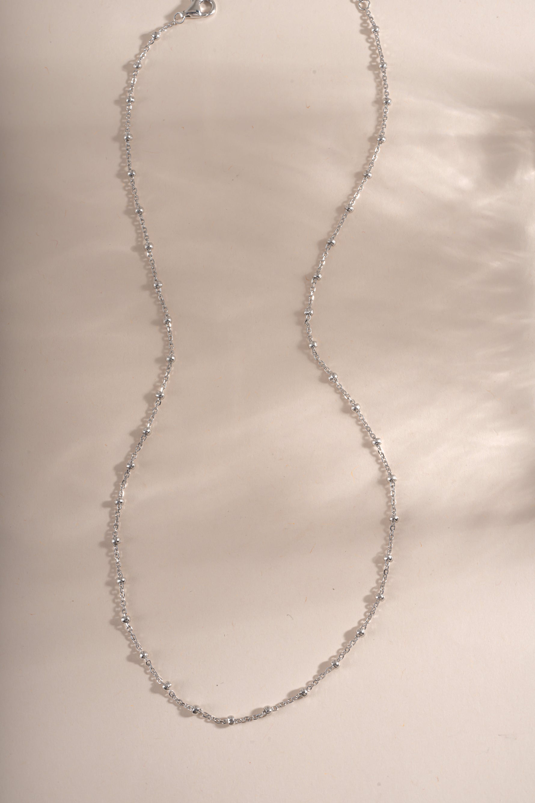 Sterling silver simple beaded necklace by Sami Jewels featuring small round beads on a delicate chain.