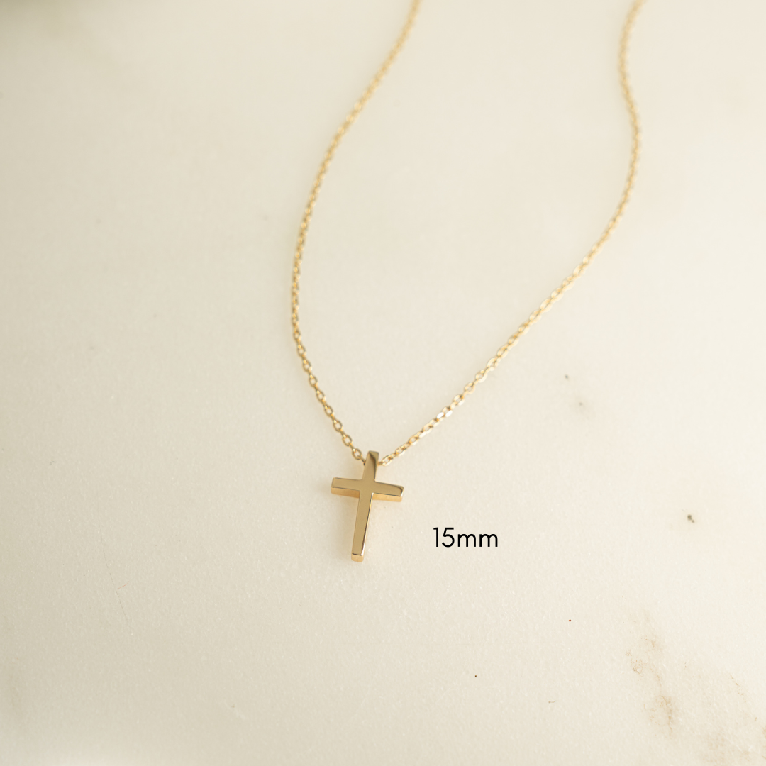 Simple 15mm Cross PendantNecklace plated in 14k gold on white background