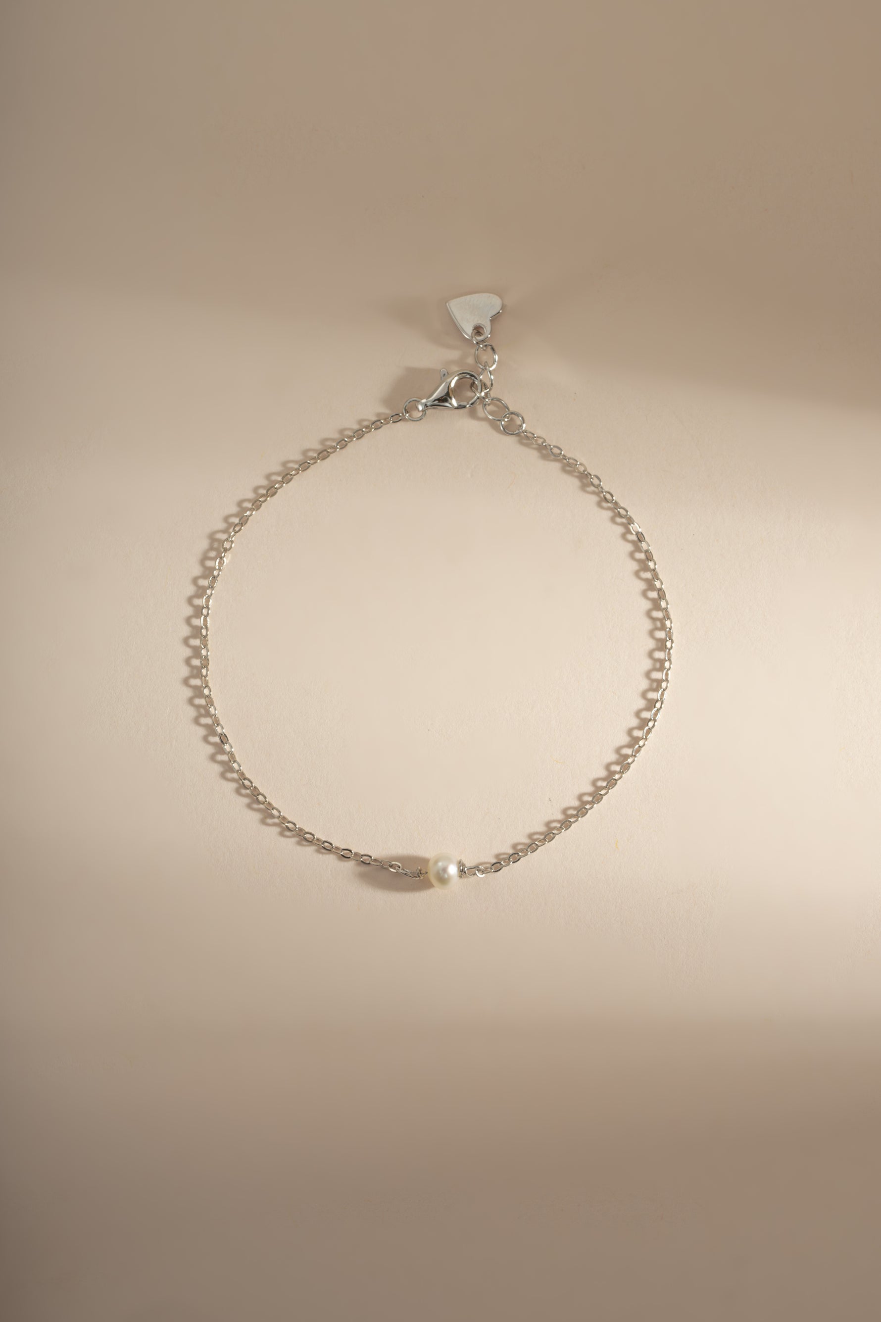 Sterling silver bracelet with elegant freshwater pearl accents, designed by Sami Jewels for a simple, sophisticated look.