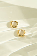 Gold stainless steel SS small hoop earrings by Sami Jewels, featuring a sleek, waterproof design with a polished profile.