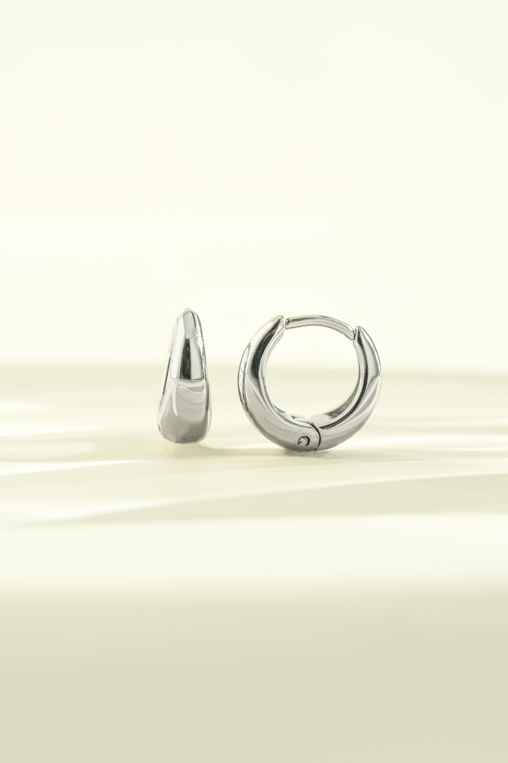 Close-up of silver stainless steel SS Small Hoops earrings by Sami Jewels, showing their sleek, waterproof design.