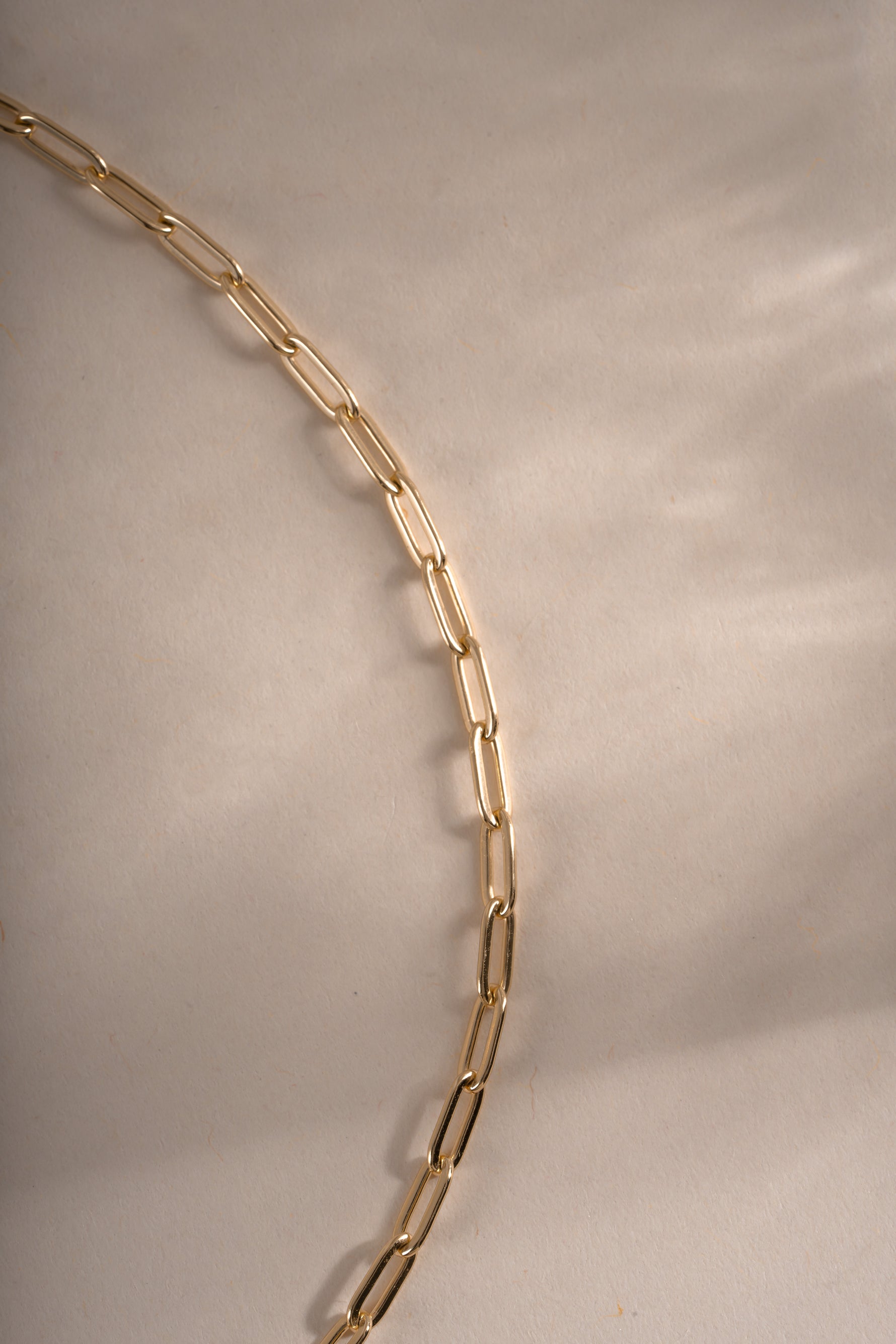 Gold Tiny Link Paperclip Necklace from Sami Jewels showing a close-up of the small paperclip chain design.