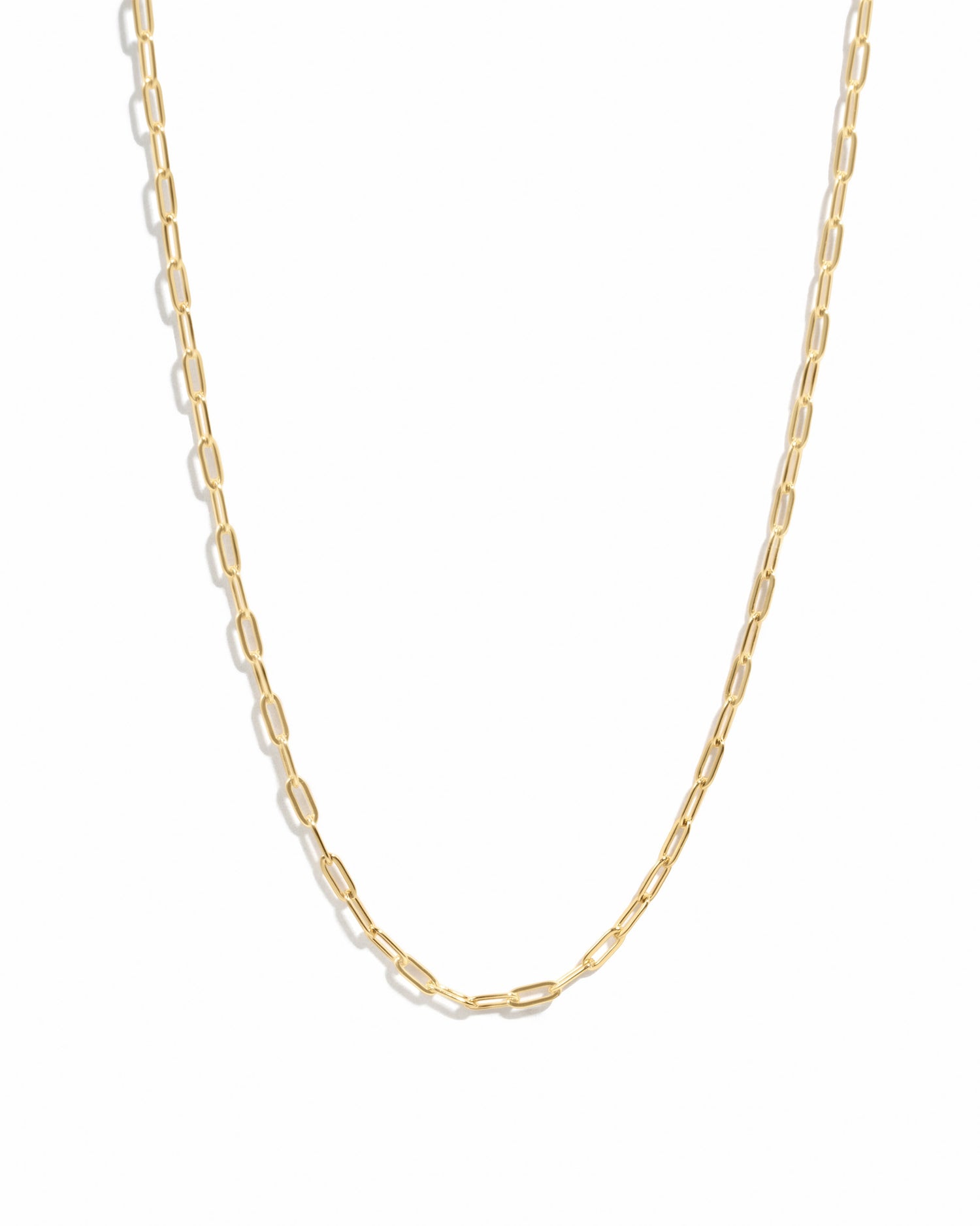 Gold Tiny Link Paperclip Necklace from Sami Jewels with delicate chain design on white background.