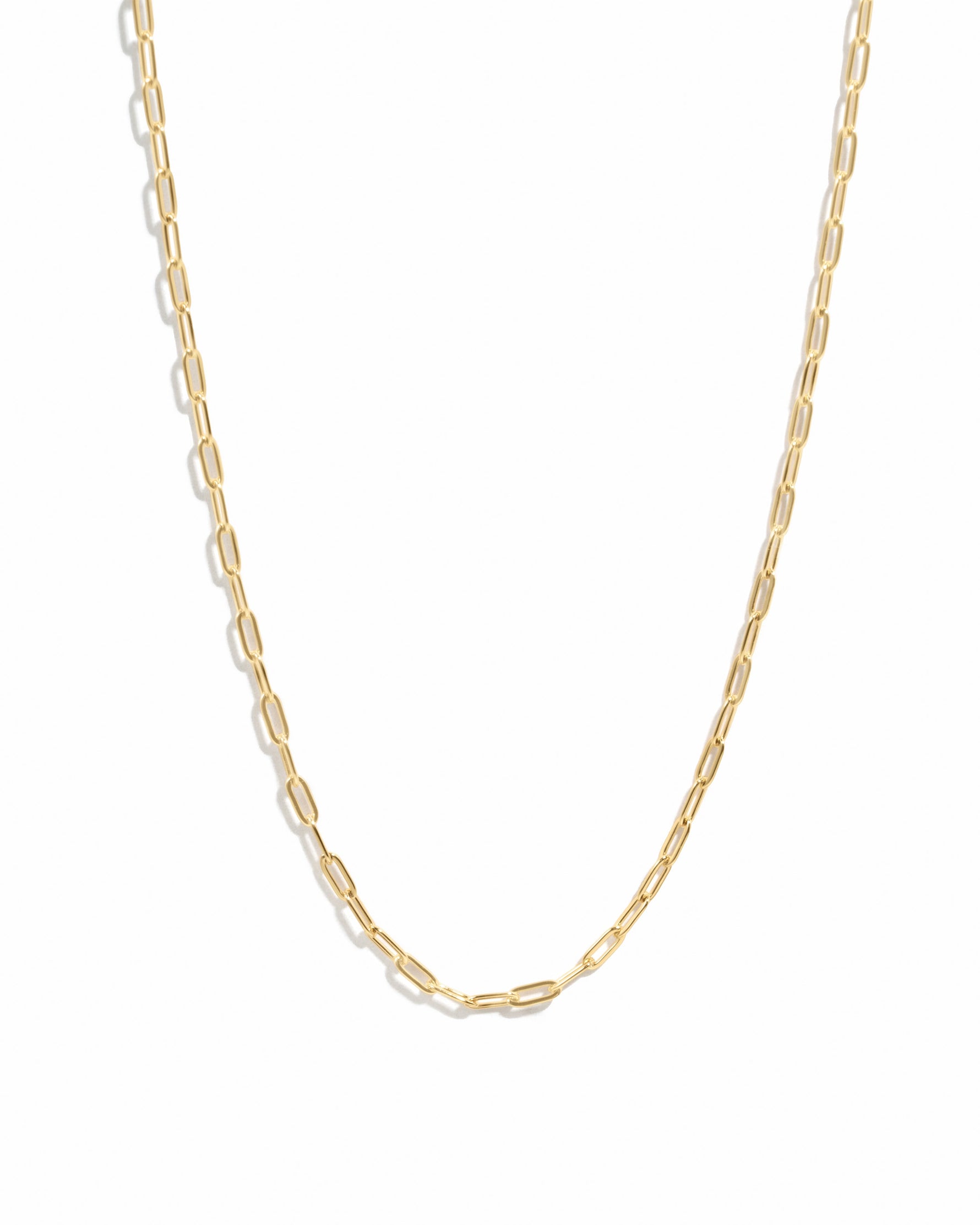 Gold Tiny Link Paperclip Necklace from Sami Jewels with delicate chain design on white background.
