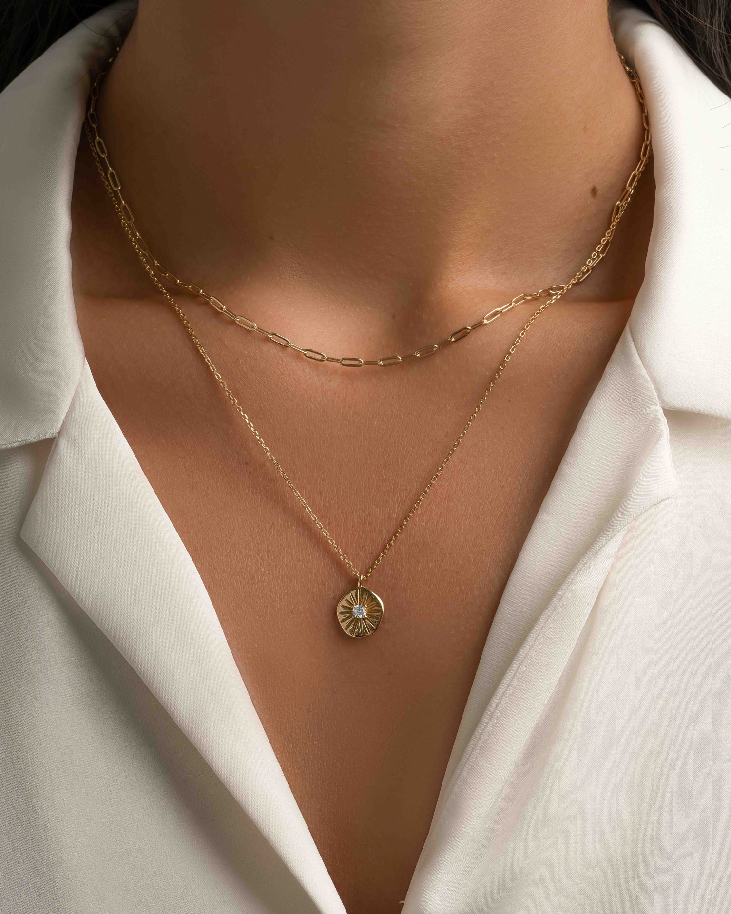 Stacked gold Small Paperclip Necklace by Sami Jewels, showcasing layered minimalist jewelry on a model.