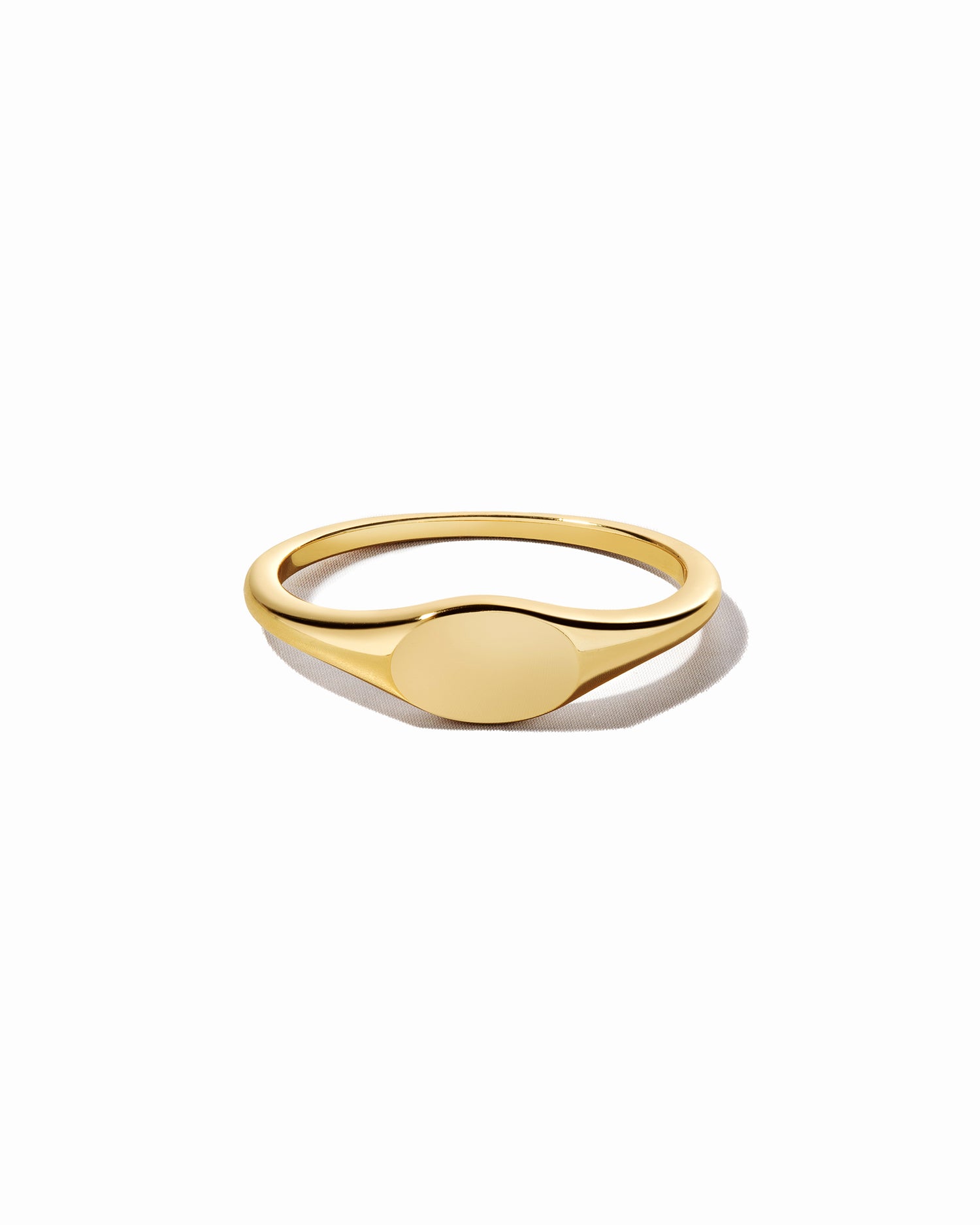 Gold small signet ring from Sami Jewels displayed on a white background, showcasing its sleek and minimalist design.