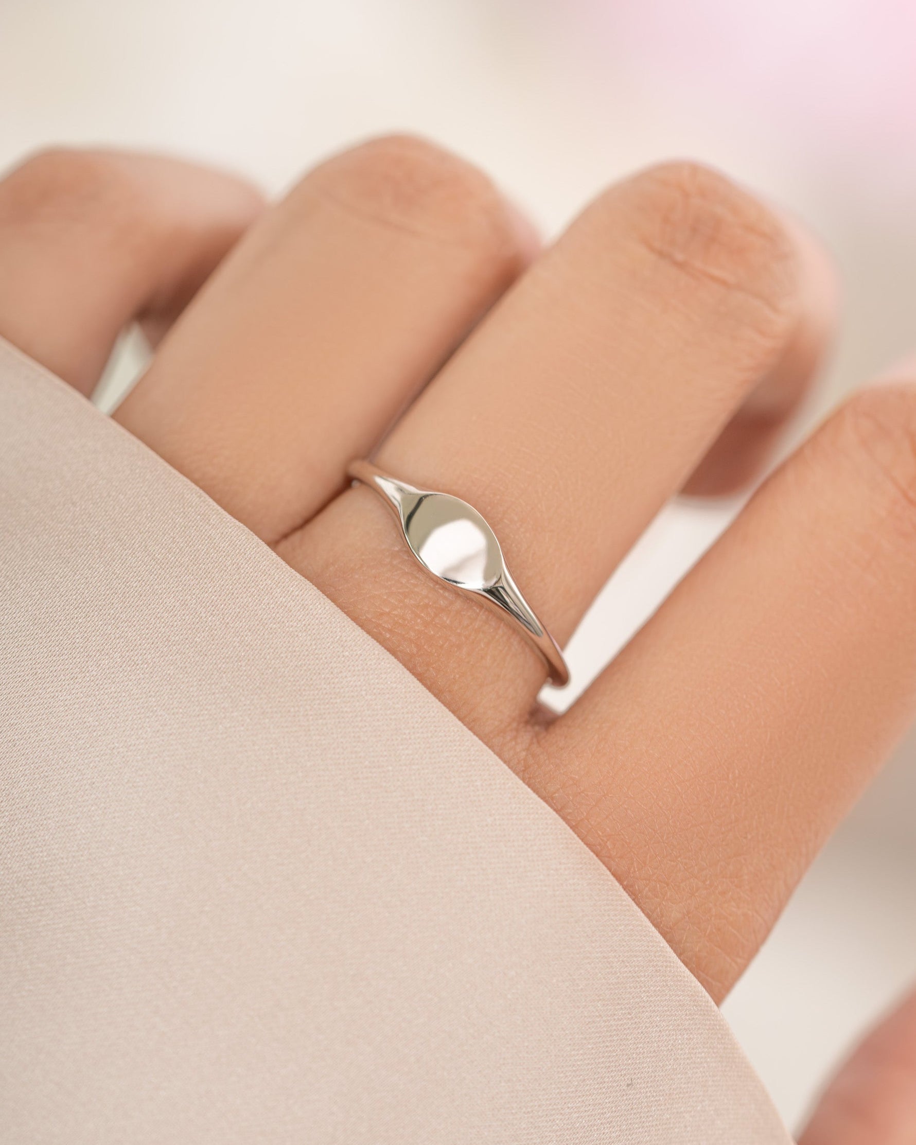 Sterling silver small signet ring from Sami Jewels, featuring a smooth, polished surface and classic ring design.