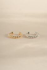 Gold and sterling silver spiral ear cuff earrings by Sami Jewels, showcasing a stylish and modern jewelry design.