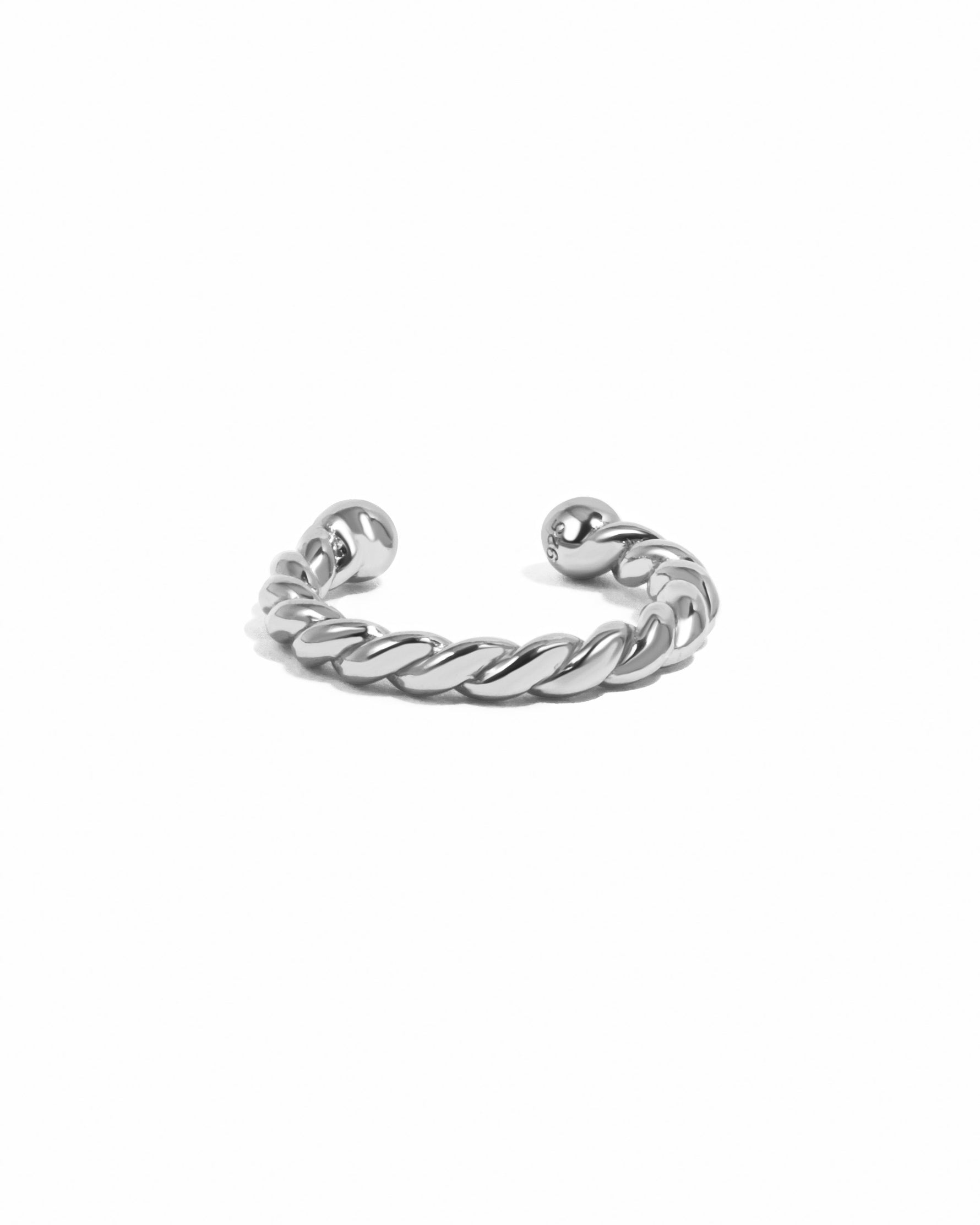 Sterling silver spiral ear cuff earrings by Sami Jewels displayed on a white background.