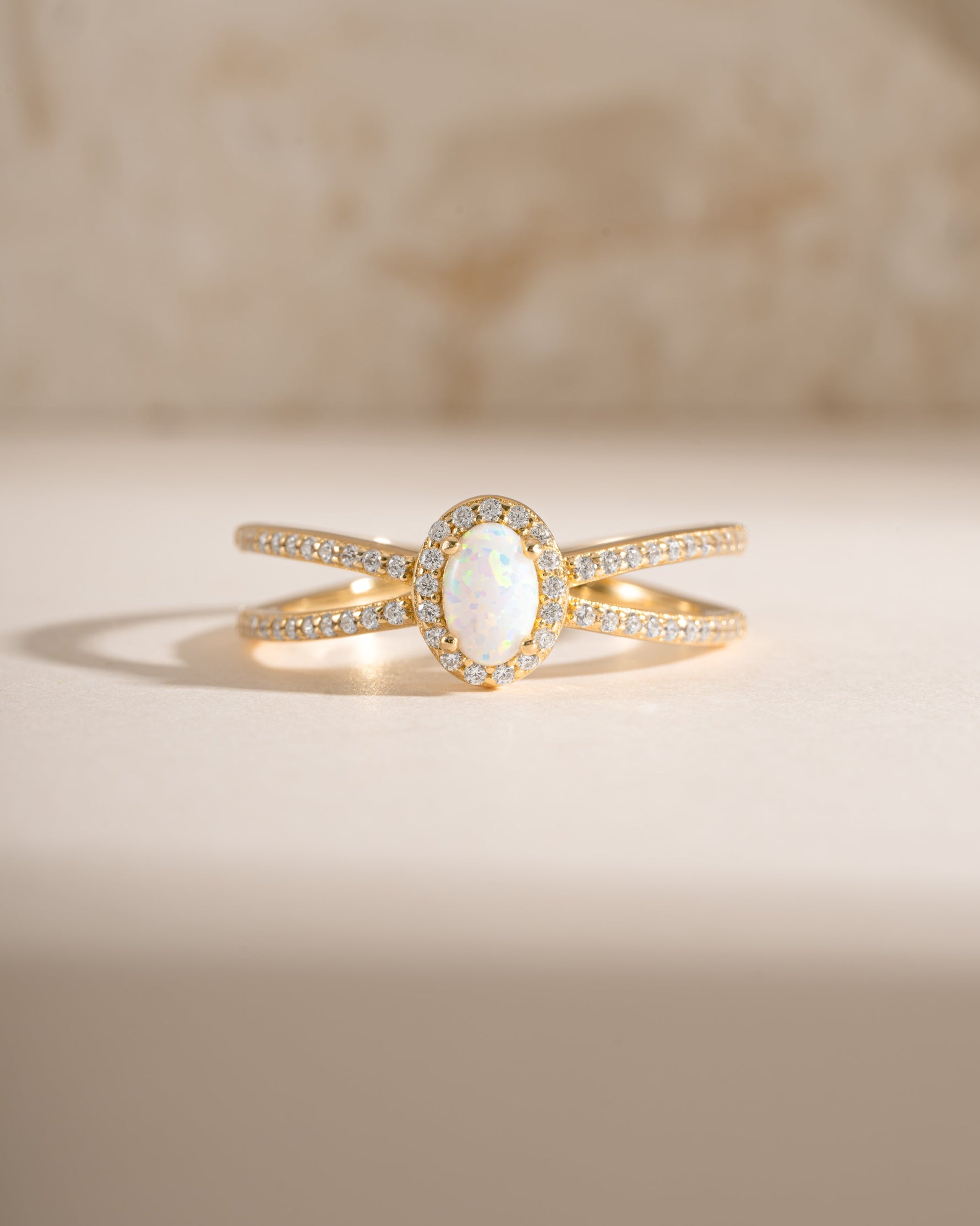 Gold Split Shank Opal Ring from Samijewels featuring a central opal gemstone and elegant split band design.