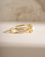 Gold split shank opal ring by Samijewels, side view showing the elegant band and vibrant opal gemstone.