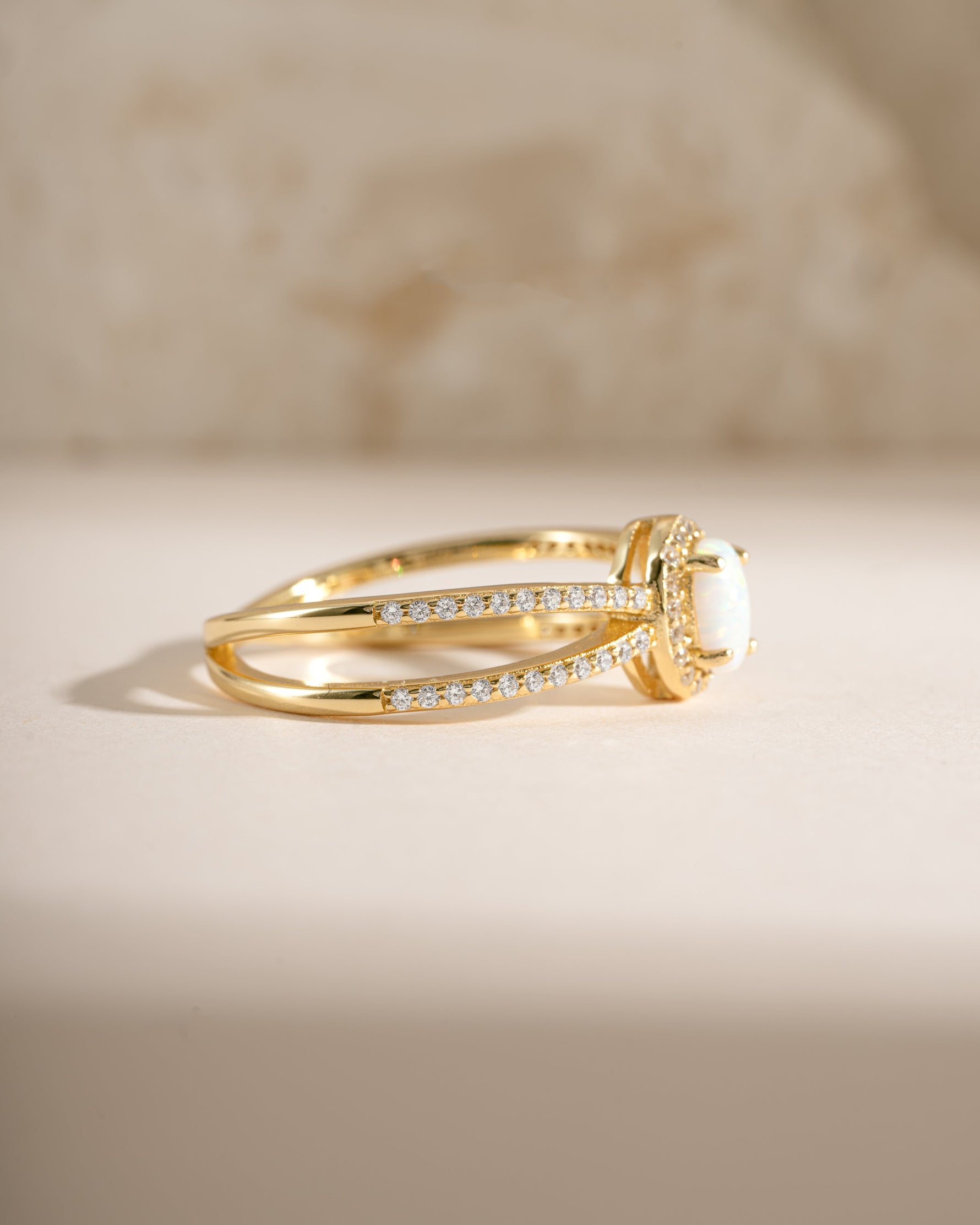 Gold split shank opal ring by Samijewels, side view showing the elegant band and vibrant opal gemstone.