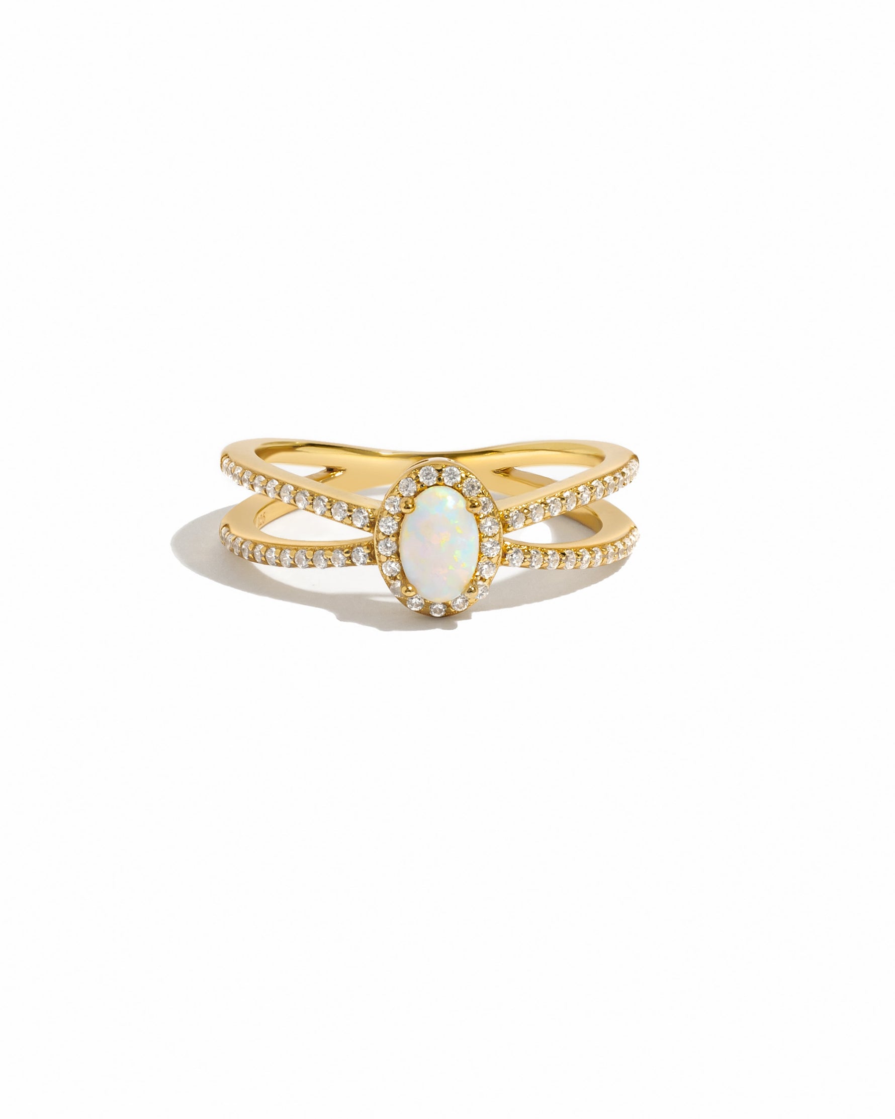 Gold split shank opal ring by Samijewels featuring a vibrant opal gemstone on a white background.