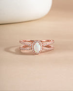 Rose gold Split Shank Opal Ring by Samijewels with a central opal gemstone and intricate split shank band design.