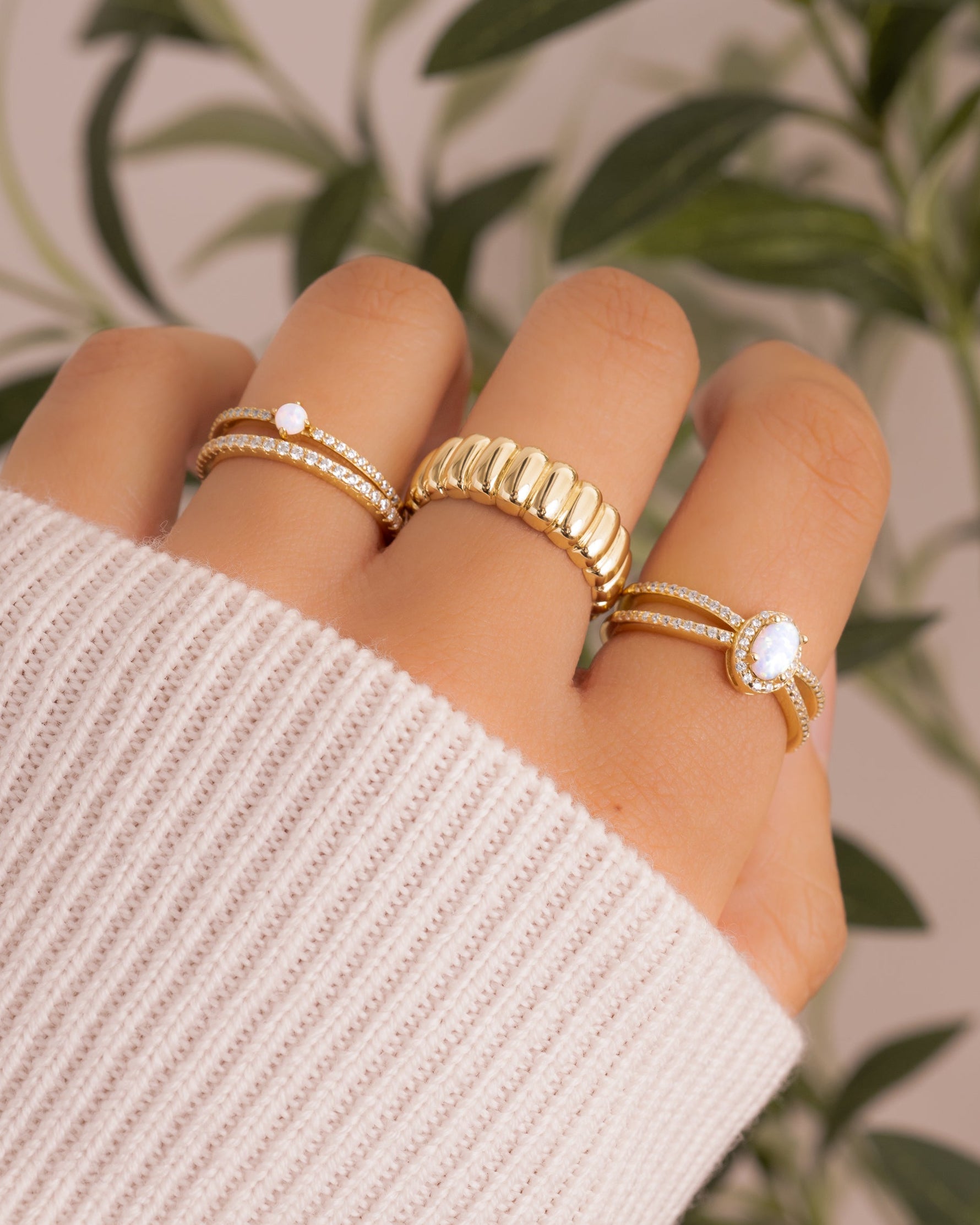 Gold split shank opal ring from Samijewels featuring a vibrant opal gemstone set in a stylish split band design.