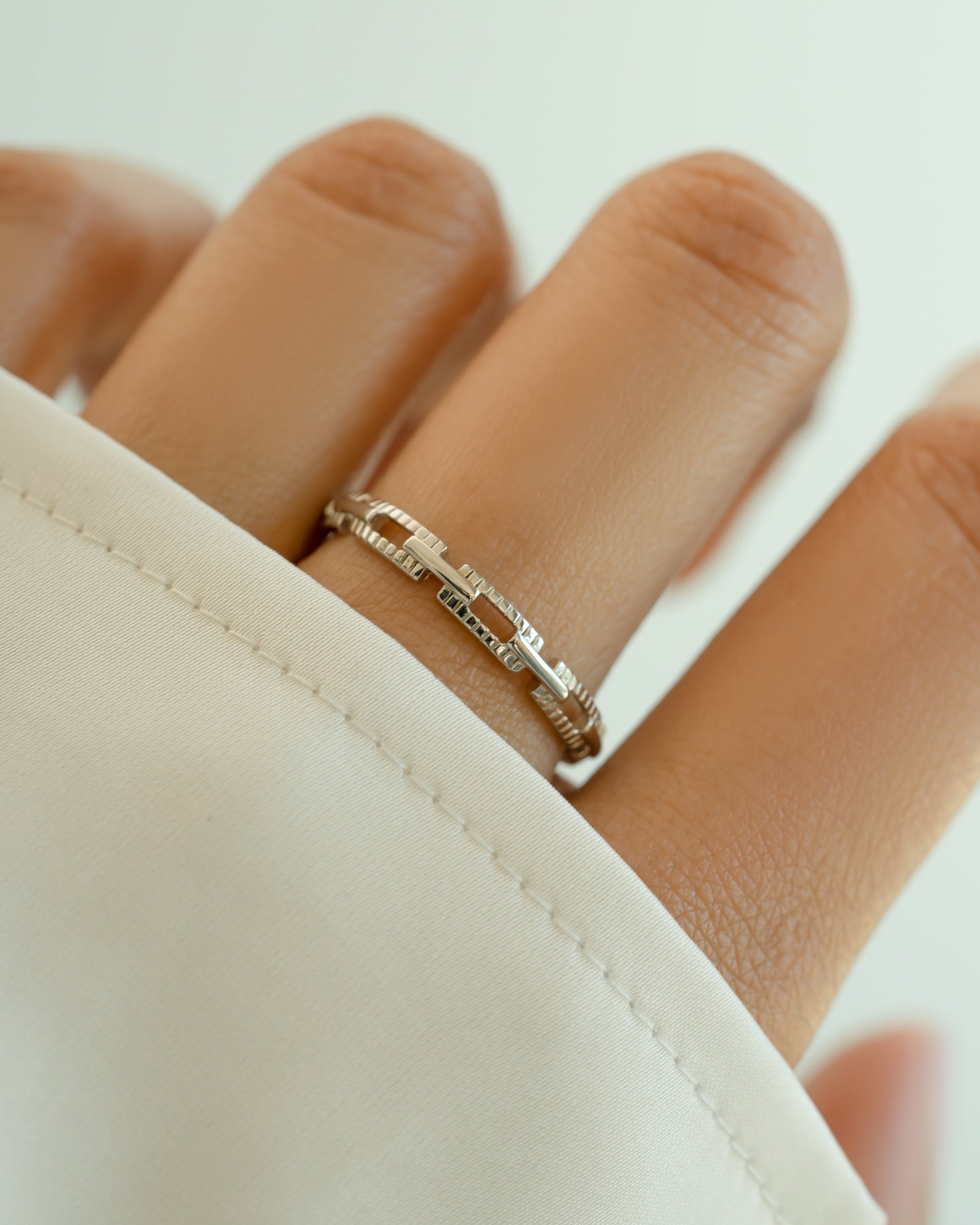 Sterling silver Square Link Ring by Sami Jewels featuring a modern geometric design on a model's hand.