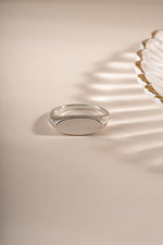 Close-up of Sami Jewels sterling silver square signet ring showing its polished, geometric design on a plain background.