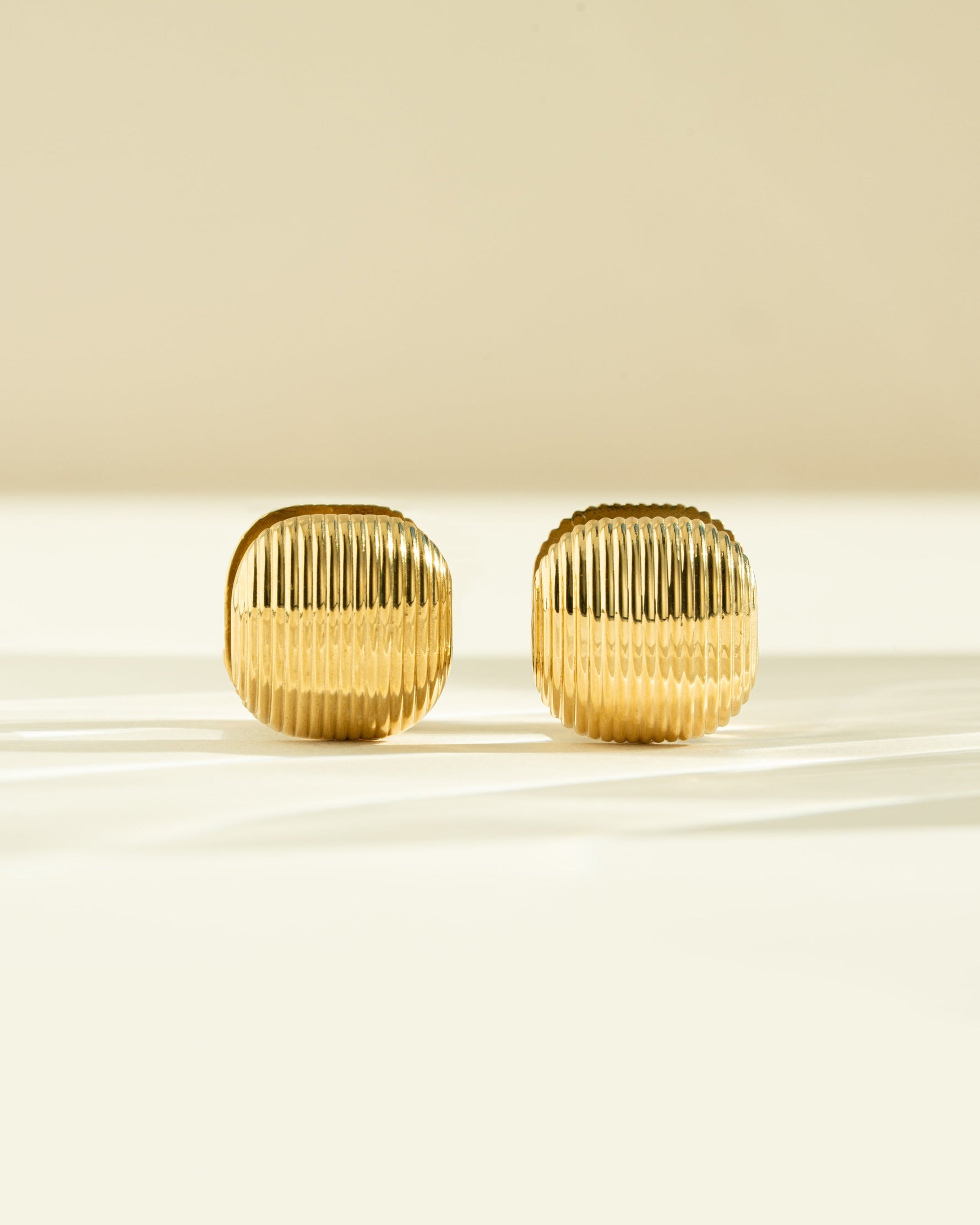 Gold stainless steel SS rounded square statement earrings by Sami Jewels, front view showcasing modern geometric design.