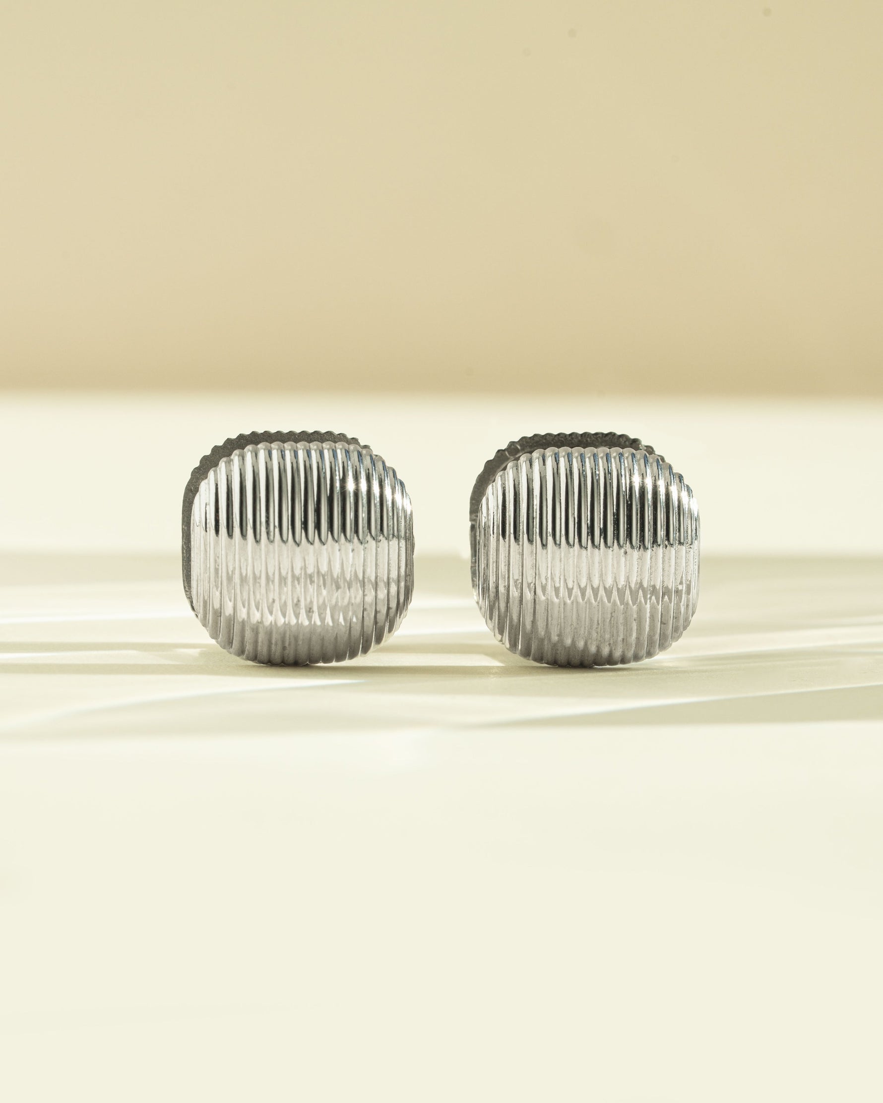 Silver stainless steel SS rounded square statement earrings by Sami Jewels, front view showcasing bold geometric design.
