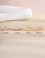 Gold Emerald Stephanie stacking ring with colorful gemstones from Sami Jewels, featuring a sleek design and vibrant gemstone accents.