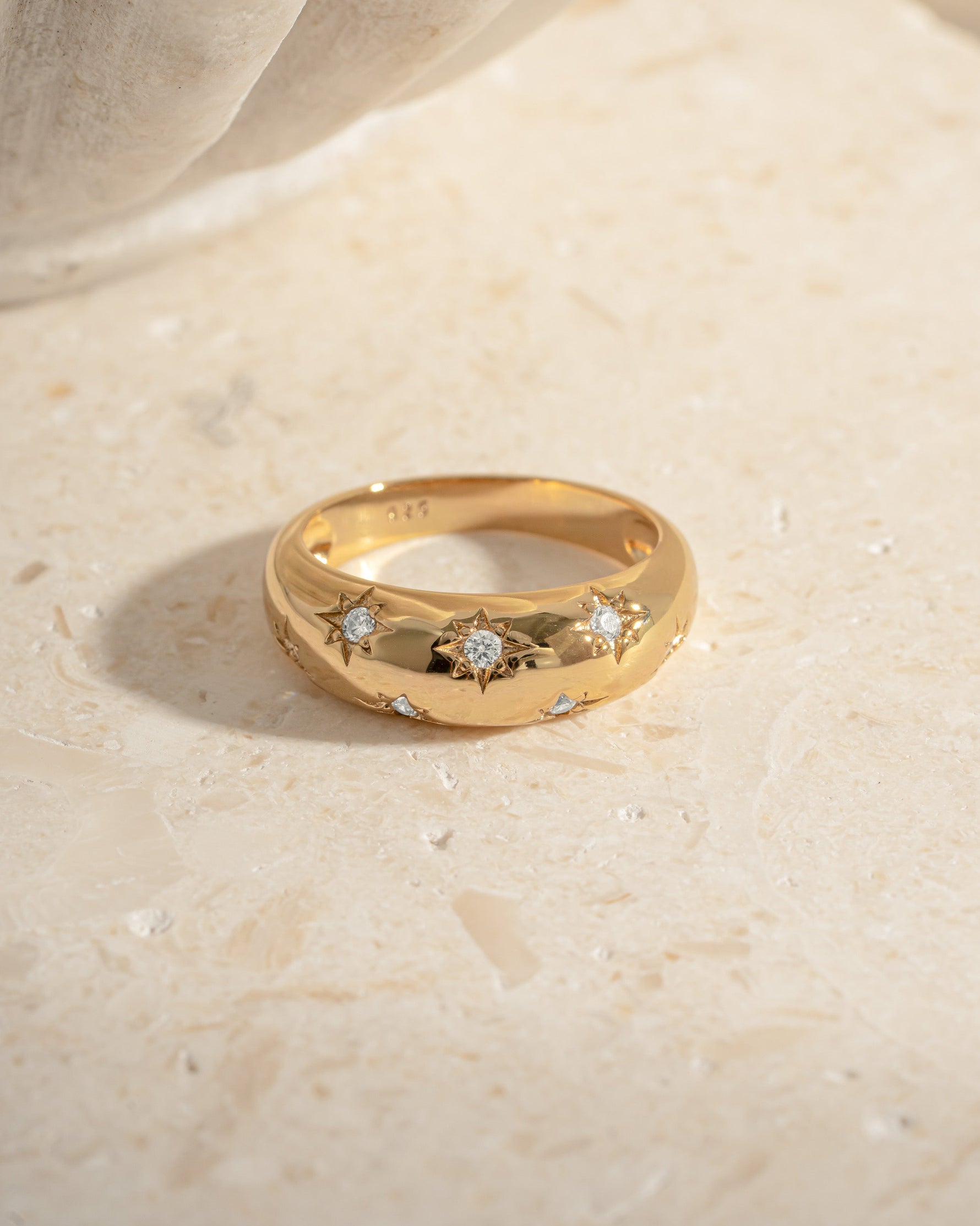 Close-up of Sami Jewels Star Dome Ring in gold, showcasing its unique dome design and intricate details.