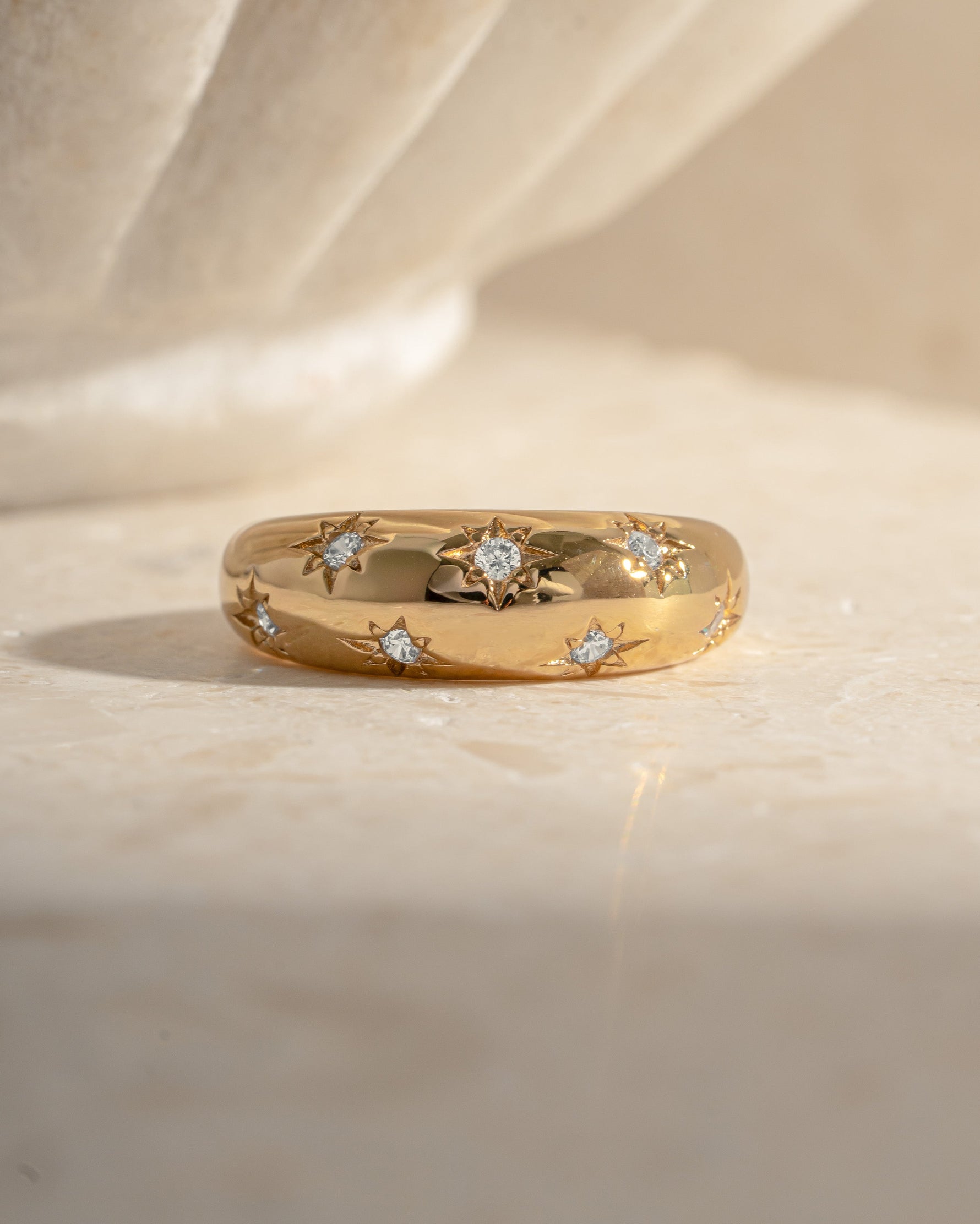 Gold Star Dome Ring by Sami Jewels featuring a unique dome design with star motifs, viewed from the front.