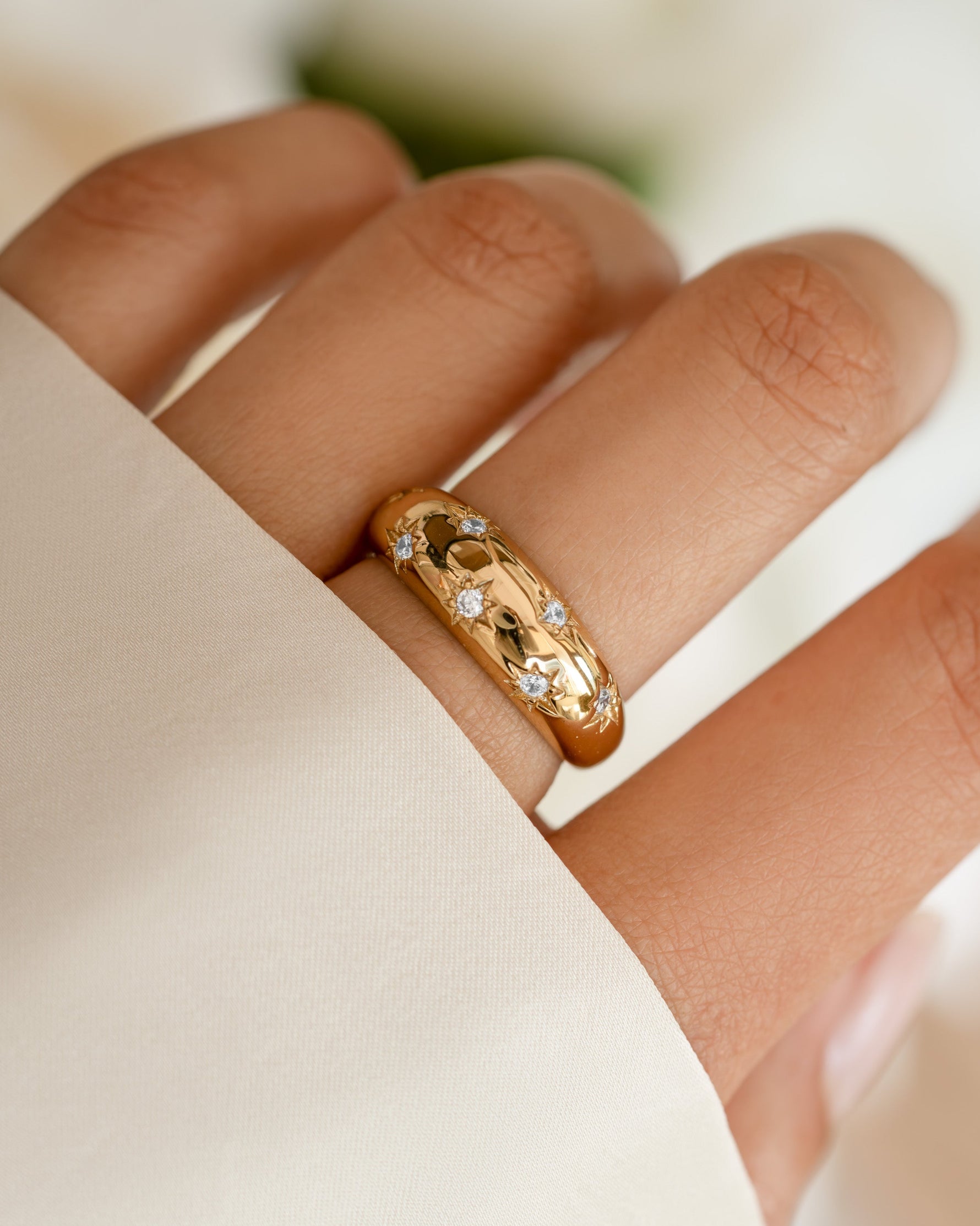 Gold Star Dome Ring by Sami Jewels showcased on a model's hand, highlighting its unique dome design and elegant style.