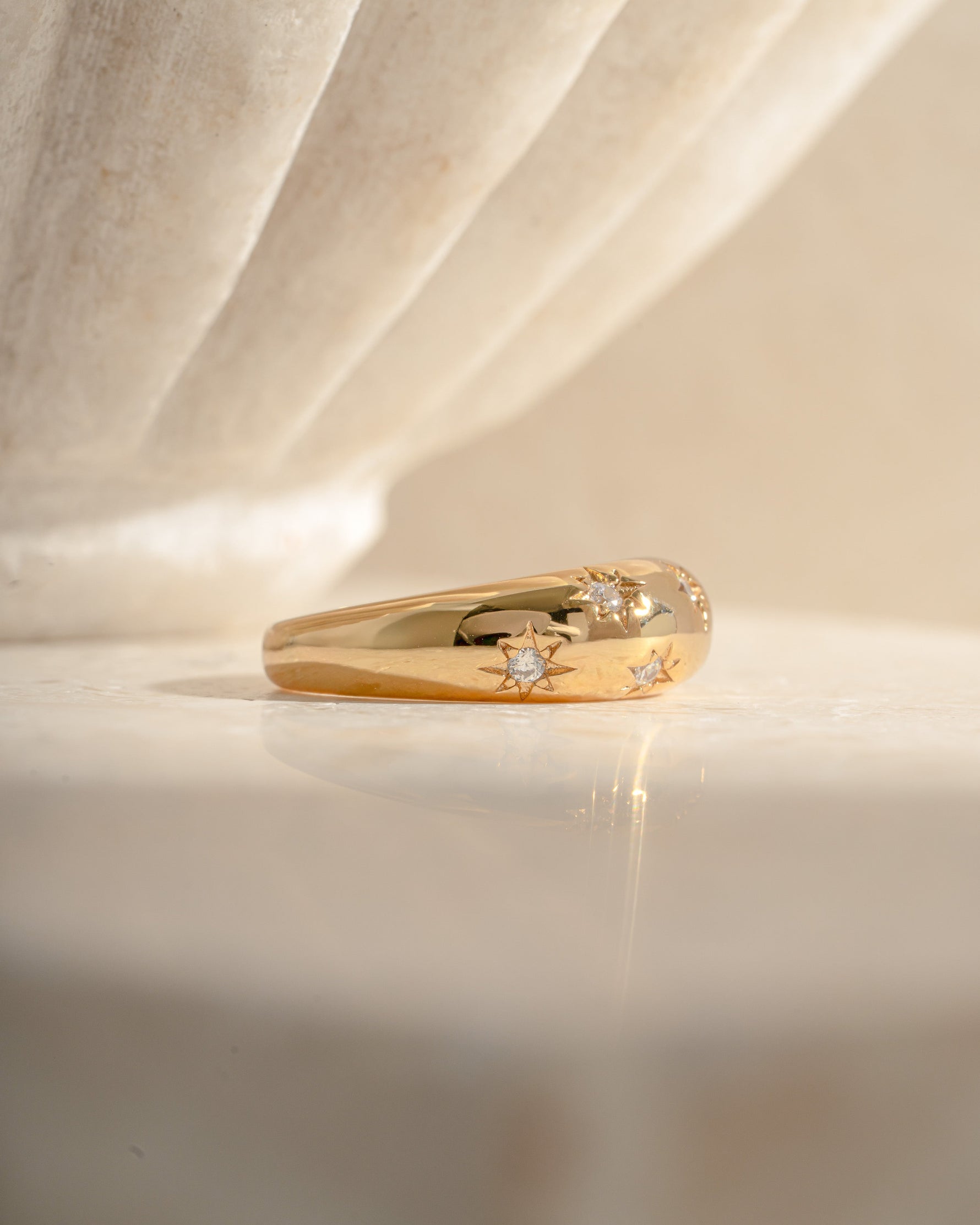 Side view of the Sami Jewels Star Dome Ring in gold, showcasing its unique dome design and elegant craftsmanship.