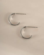 Sterling silver star-studded hoop earrings by Sami Jewels, showcasing a side profile view with celestial star accents.