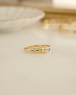 Gold Baguette Starburst Ring by Sami Jewels featuring a dazzling starburst design with baguette-cut diamonds.