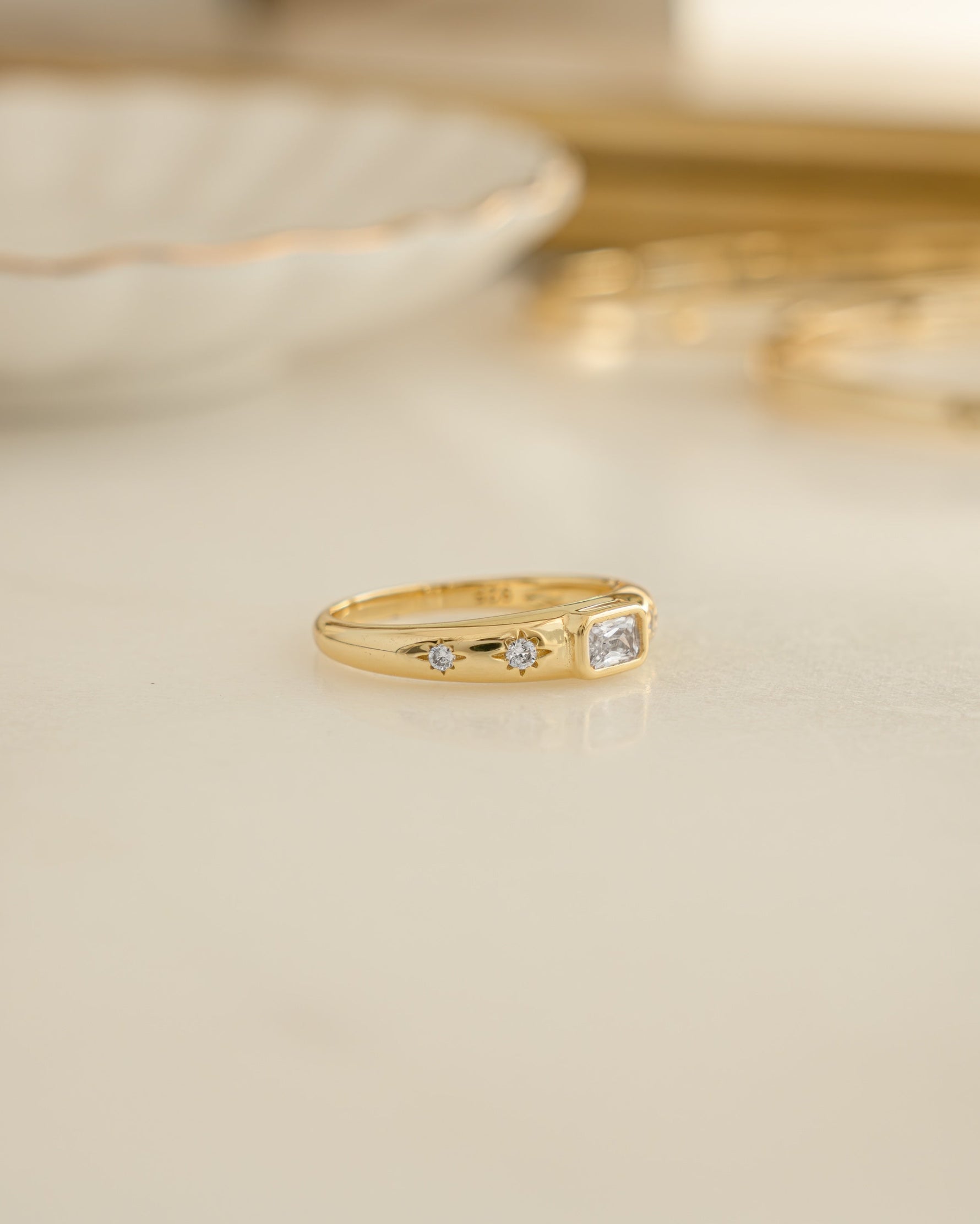 Gold Baguette Starburst Ring by Sami Jewels featuring a dazzling starburst design with baguette-cut diamonds.