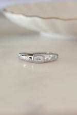 Sterling silver Baguette Starburst Ring by Sami Jewels featuring a starburst design and baguette-cut accents, front view.
